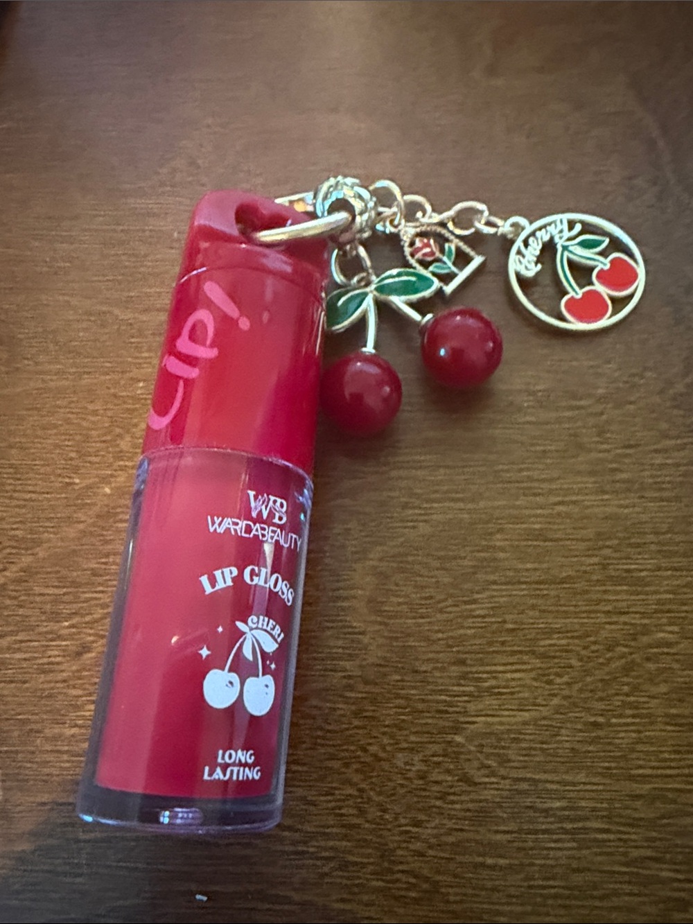 Cherry Red Lip Gloss with Charm Accent